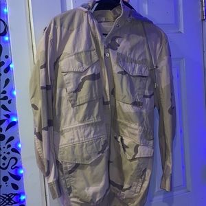 Cream color camo jacket with a grey hoodie